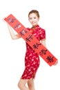 Happy asian woman showing chinese Spring festival couplets Royalty Free Stock Photo