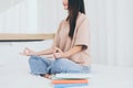 Happy asian woman sitting in bedroom practicing doing yoga meditation,Workout exercise after waking up in morning,lotus position,H Royalty Free Stock Photo