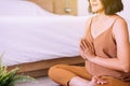 Happy asian woman sitting practicing doing yoga meditation in bedroom,Workout exercise after waking up in morning,Healthy and life Royalty Free Stock Photo