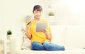 Happy asian woman with tablet pc and credit card Royalty Free Stock Photo