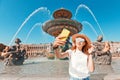 Asian woman taking selfie at the Neptune fountain in Concorde Square. Tour in Paris Royalty Free Stock Photo