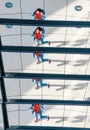 Happy asian woman traveler looking at the miror of the Dome in Berlin Reichstag roof at the famous