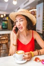 Asian woman using mobile phone during breakfast in coffee shop Royalty Free Stock Photo