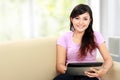 Happy asian woman using tablet pc Royalty Free Stock Photo