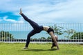 Happy Asian woman wearing black sport wear practice yoga bridge Pose Royalty Free Stock Photo