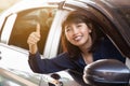 Happy Asian womanl in a car Royalty Free Stock Photo