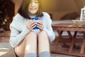 Happy asian woman holding and drinking hot coffee in the morning,Enjoys of resting time Royalty Free Stock Photo