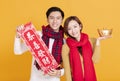 Happy asian young couple celebrating  chinese new year. chinese text : congratulation and  get rich Royalty Free Stock Photo