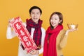 Happy asian young couple celebrating  chinese new year. chinese text : congratulation and  get rich Royalty Free Stock Photo