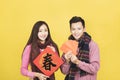 Happy asian young couple celebrating for chinese new year. chinese text: spring Royalty Free Stock Photo