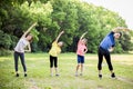 Happy asian young family exercising  together at the park Royalty Free Stock Photo