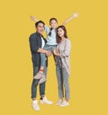 Happy Asian young family with one child standing embracing and smiling Royalty Free Stock Photo