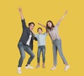 Happy Asian young family with one child standing embracing and smiling Royalty Free Stock Photo