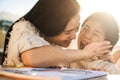 Happy asian young mother having fun with her child outdoors in summer sunny day - Focus on woman face Royalty Free Stock Photo