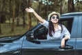 Happy Asian young woman enjoying a ride in a car Royalty Free Stock Photo