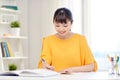 Happy asian young woman student learning at home Royalty Free Stock Photo