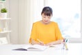 Happy asian young woman student learning at home Royalty Free Stock Photo