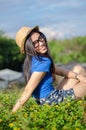 Happy Asians female in cowgirl hat and wear glasses looking at Royalty Free Stock Photo