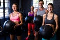 Happy athletes exercising with fitness ball Royalty Free Stock Photo