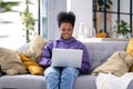 Happy attractive african american girl working office work remotely from home Black woman using laptop computer Distance Royalty Free Stock Photo