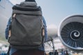 Happy attractive asian woman traveler with backpack at the modern airport terminal, copy space, Tourist journey trip concept Royalty Free Stock Photo