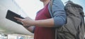 Happy attractive asian woman traveler with backpack at the modern airport terminal, copy space, Tourist journey trip concept Royalty Free Stock Photo