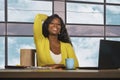 Happy and attractive black African American business woman smiling confident working at office computer desk in successful Royalty Free Stock Photo