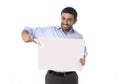 Happy attractive businessman holding blank billboard as copyspace Royalty Free Stock Photo