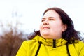 Happy attractive chubby overweight Caucasian woman smiling portrait outdoors. Cheerful pretty body positive person laughing