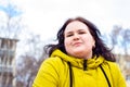 Happy attractive chubby overweight Caucasian woman smiling portrait outdoors