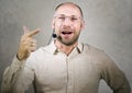 Happy attractive and confident businessman speaker with headset giving coaching conference training for business success smiling Royalty Free Stock Photo