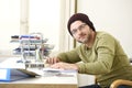Happy attractive hipster businessman working with computer laptop at home office Royalty Free Stock Photo