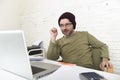 Happy attractive hipster businessman working with computer laptop at home office Royalty Free Stock Photo