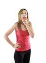 Happy attractive mature woman on her 40s eating apple fruit in diet concept Royalty Free Stock Photo