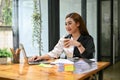 Happy Asian businesswoman working on her business work on laptop Royalty Free Stock Photo