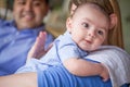 Mixed Race Couple Burping Their Infant Son