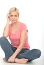 Happy Attractive Relaxed Young Woman Sitting on the Floor Smiling