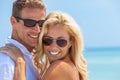 Happy Attractive Woman and Man Couple In Sunglasses At Beach Royalty Free Stock Photo