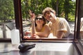 Happy attractive young couple romantically eating a fresh pizza outdoors. Royalty Free Stock Photo