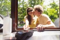 Happy attractive young couple romantically eating a fresh pizza outdoors. Royalty Free Stock Photo