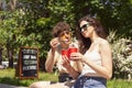 Happy attractive young couple romantically eating a fresh pizza outdoors. Royalty Free Stock Photo