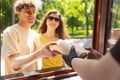 Happy attractive young couple romantically eating a fresh pizza outdoors. Royalty Free Stock Photo