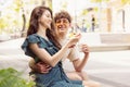 Happy attractive young couple romantically eating a fresh pizza outdoors. Royalty Free Stock Photo