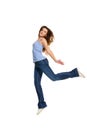 Happy attractive young girl, teenager dressed casual outfit jumping, running against white studio background. Royalty Free Stock Photo