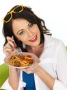 Happy Attractive Young Woman Holding a Plate of Spaghetti Meatballs Royalty Free Stock Photo