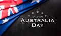 Happy Australia day concept. Australian flag and the text against dark stone background Royalty Free Stock Photo