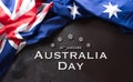 Happy Australia day concept. Australian flag and the text against dark stone background Royalty Free Stock Photo