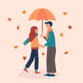 Happy autumn couple walking with umbrella