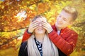 Happy autumn fall couple. Young woman girlfriend and man boyfriend having fun, enjoying outdoors. Yellow leaves. Royalty Free Stock Photo