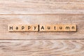 Happy autumn word written on wood block. Happy autumn text on wooden table for your desing, concept Royalty Free Stock Photo